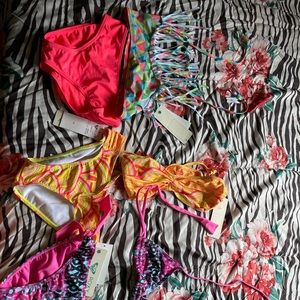 3 bathing suits. (2) size 14 (1) size 16